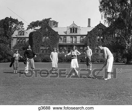 Stock Photo - 1920S Two Women Four Men Upper Class Playing Golf At The Berkshires Hunt And Country Club Outdoor . Fotosearch