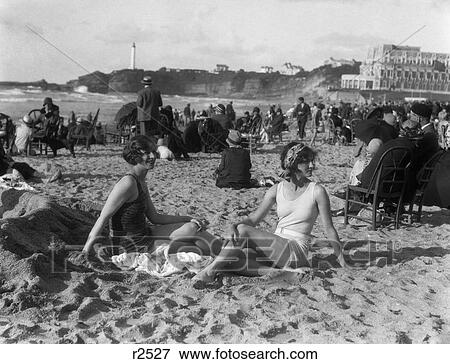 1920S Two Women Sitting On Beach Biarritz France Bay Biscay Bathing Suit View Large Photo Image Stock Photo - 1920S Two Women Sitting On Beach Biarritz France Bay Biscay Bathing Suit. Fotosearch