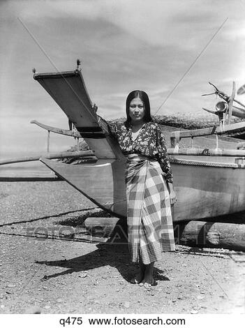 1930 1930S 1940 1940S A Moro Girl Native Costume Standing By Catamaran On Beach In Zamboanga Rrr Retro View Large Photo Image Stock Photography - 1930 1930S 1940 1940S A Moro Girl Native Costume Standing By Catamaran On Beach In Zamboanga Rrr Retro . Fotosearch