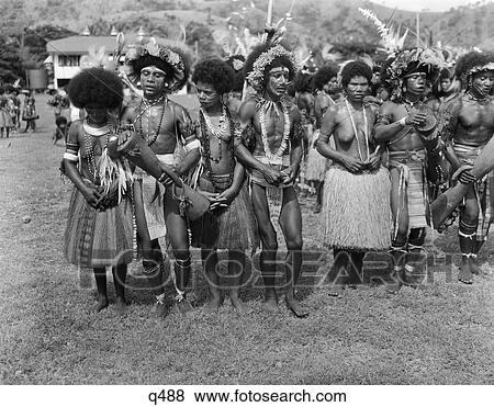 1930 1930S 1940 1940S Group Of Native Papuan Dancers In Costume Grass Skirt Music Folk Dance Port Moresby New Guinea Rrr Retro View Large Photo Image Stock Photo - 1930 1930S 1940 1940S Group Of Native Papuan Dancers In Costume Grass Skirt Music Folk Dance Port Moresby New Guinea Rrr Retro. Fotosearch