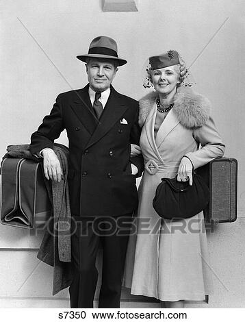 1930 1930S 1940 1940S Older Couple Dressed Up With Luggage View Large Photo Image Stock Image - 1930 1930S 1940 1940S Older Couple Dressed Up With Luggage . Fotosearch