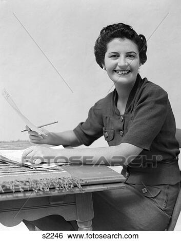 1930 1930S 1940 1940S Woman Sitting At Desk With Papers And Pencil View Large Photo Image Stock Photograph - 1930 1930S 1940 1940S Woman Sitting At Desk With Papers And Pencil . Fotosearch