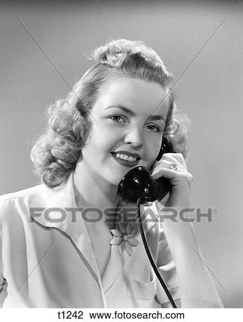 1930 1930S 1940 1940S Young Woman Talking On Telephone View Large Photo Image Stock Image - 1930 1930S 1940 1940S Young Woman Talking On Telephone . Fotosearch