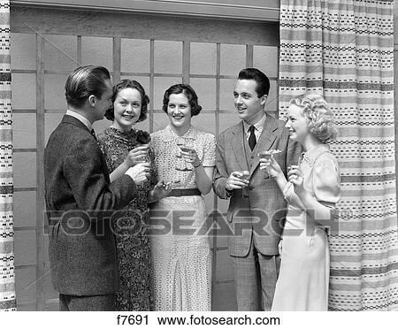 1930 1930S 2 Men 3 Women Toasting Party Drinking Alcohol Drink Couples Couple Man Woman Cocktail Cocktails Group Retro View Large Photo Image Stock Image - 1930 1930S 2 Men 3 Women Toasting Party Drinking Alcohol Drink Couples Couple Man Woman Cocktail Cocktails Group Retro . Fotosearch
