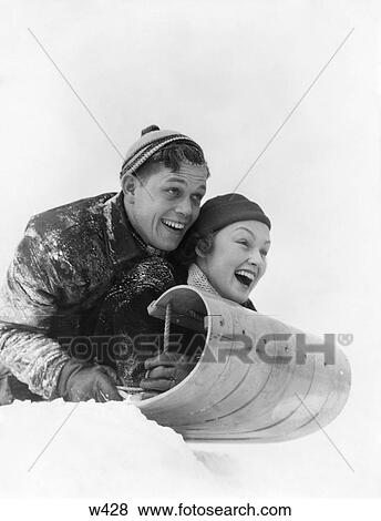 1930 1930S Couple On Sled Laughing View Large Photo Image Stock Photo - 1930 1930S Couple On Sled Laughing. Fotosearch