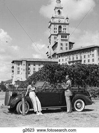 1930 1930S Couple With Golf Clubs Standing By A Car In Front Of The Biltmore Hotel Miami Florida View Large Photo Image Stock Image - 1930 1930S Couple With Golf Clubs Standing By A Car In Front Of The Biltmore Hotel Miami Florida . Fotosearch