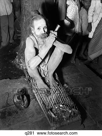 1930 1930S Hindu Holy Man Sitting Bed Spikes Nails Fakir Bombay India Retro Bed Of Nails Pain Painful Rrr Stock Image | q281 | Fotosearch 1930 1930S Hindu Holy Man Sitting Bed Spikes Nails Fakir Bombay India Retro Bed Of Nails Pain Painful Rrr Stock Image | q281 | Fotosearch