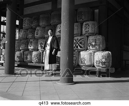 1930 1930S Japanese Man In Robes Priest Standing Amid Sacred Sake Rice Wine Casks At Heian Shrine Rrr Retro View Large Photo Image Stock Image - 1930 1930S Japanese Man In Robes Priest Standing Amid Sacred Sake Rice Wine Casks At Heian Shrine Rrr Retro . Fotosearch
