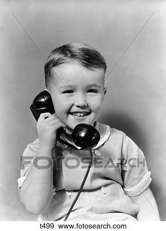 1930 1930S Little Boy Smiling Talking On Telephone View Large Photo Image Stock Photo - 1930 1930S Little Boy Smiling Talking On Telephone. Fotosearch