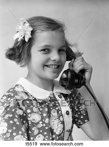 Stock Photo - 1930 1930S Little Girl Talking On Telephone . Fotosearch