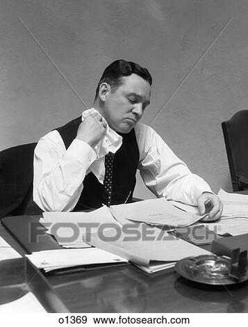 1930 1930S Man At Desk In Office Wiping Neck With Handkerchief View Large Photo Image Stock Photo - 1930 1930S Man At Desk In Office Wiping Neck With Handkerchief . Fotosearch