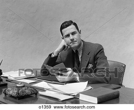1930 1930S Man At Desk In Office With Book View Large Photo Image Stock Photo - 1930 1930S Man At Desk In Office With Book . Fotosearch