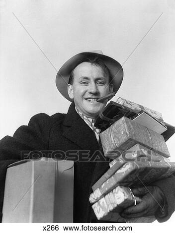 1930 1930S Man Cigar In Mouth Hat Carrying Wrapped Presents View Large Photo Image Stock Photograph - 1930 1930S Man Cigar In Mouth Hat Carrying Wrapped Presents. Fotosearch