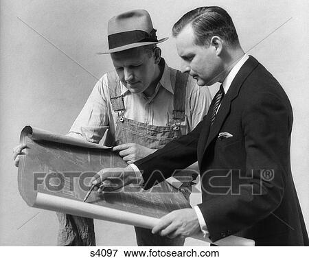 1930 1930S Man In Suit Going Over Blue Prints With A Customer View Large Photo Image Stock Photo - 1930 1930S Man In Suit Going Over Blue Prints With A Customer . Fotosearch
