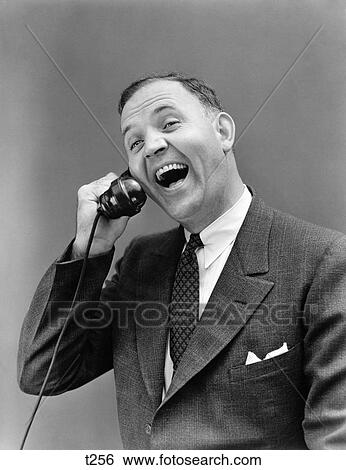 1930 1930S Man In Suit Laughing Talking On Telephone View Large Photo Image Stock Photograph - 1930 1930S Man In Suit Laughing Talking On Telephone . Fotosearch