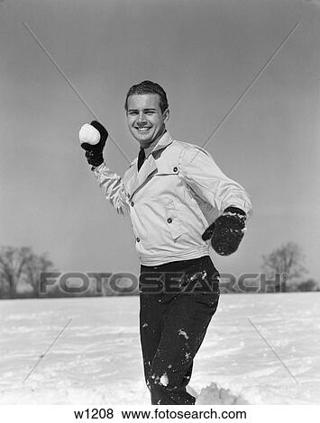 1930 1930S Man Playing Outside About To Throw Snowball View Large Photo Image Stock Photo - 1930 1930S Man Playing Outside About To Throw Snowball . Fotosearch