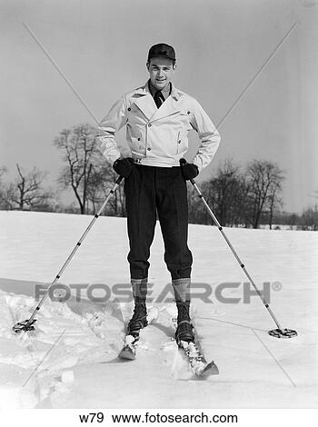 1930 1930S Man Posing In Skis Holding Ski Poles On Snow View Large Photo Image Stock Photo - 1930 1930S Man Posing In Skis Holding Ski Poles On Snow . Fotosearch