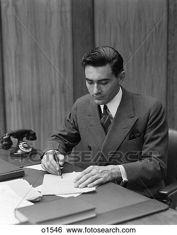 1930 1930S Man Sitting At Desk In Office Writing View Large Photo Image Stock Photograph - 1930 1930S Man Sitting At Desk In Office Writing . Fotosearch
