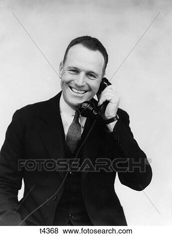 1930 1930S Man Talking On Telephone View Large Photo Image Stock Photo - 1930 1930S Man Talking On Telephone . Fotosearch