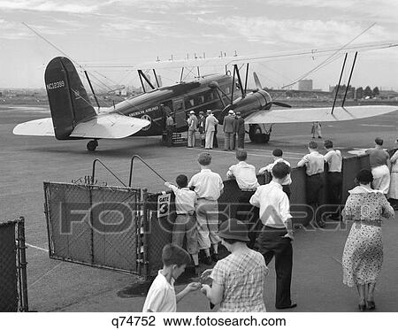 Stock Image - 1930 1930S Passengers Boarding American Airlines Condor Plane For Boston At Newark Nj Airport Air Travel Aviation Retro. Fotosearch