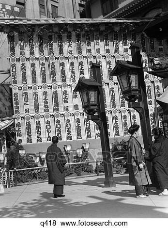 1930 1930S People Reading Actors Names On Billboard Of Japanese Characters Sign At Kabuki Theater In Tokyo View Large Photo Image Stock Photo - 1930 1930S People Reading Actors Names On Billboard Of Japanese Characters Sign At Kabuki Theater In Tokyo . Fotosearch