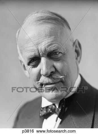 1930 1930S Portrait Senior Older Man Bow Tie Mustache Serious Facial Expression Concern Worry Retro View Large Photo Image Stock Photograph - 1930 1930S Portrait Senior Older Man Bow Tie Mustache Serious Facial Expression Concern Worry Retro . Fotosearch