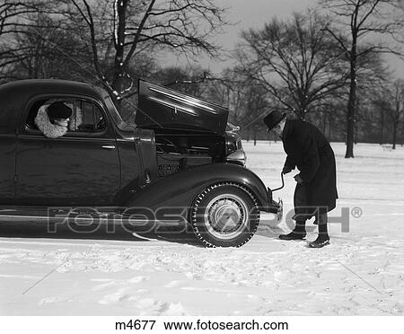 1930 1930S Retro Car Trouble Hood Couple Engine Crank View Large Photo Image Stock Photo - 1930 1930S Retro Car Trouble Hood Couple Engine Crank . Fotosearch