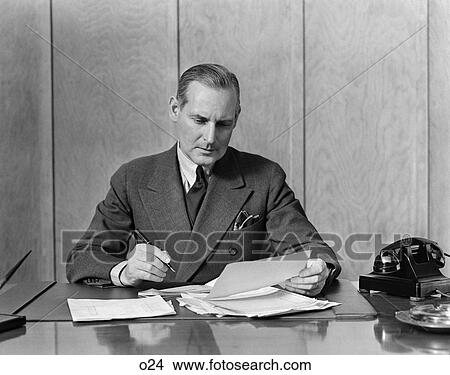 1930 1930S Retro Man Office Desk Pen Telephone Work Business Paperwork Suit View Large Photo Image Picture - 1930 1930S Retro Man Office Desk Pen Telephone Work Business Paperwork Suit . Fotosearch