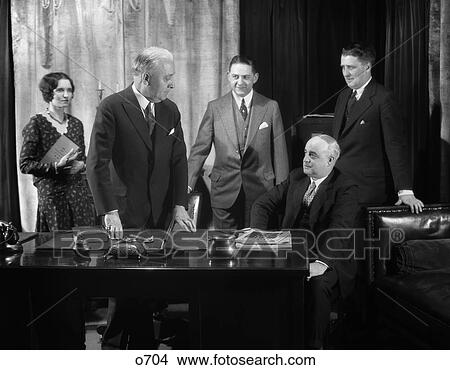 Picture - 1930 1930S Retro Meeting Men Woman Desk Business Conference . Fotosearch