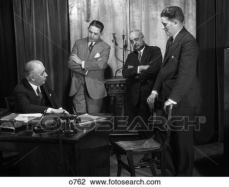 1930 1930S Retro Men Meeting Desk Business Suits Telephone Chair View Large Photo Image Stock Image - 1930 1930S Retro Men Meeting Desk Business Suits Telephone Chair . Fotosearch
