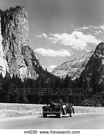 Stock Image - 1930 1930S Retro Mountains Car Trees . Fotosearch