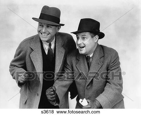 1930 1930S Two Men Wearing Hats Coats And Gloves Cheering Rooting For A Race View Large Photo Image Stock Photo - 1930 1930S Two Men Wearing Hats Coats And Gloves Cheering Rooting For A Race. Fotosearch