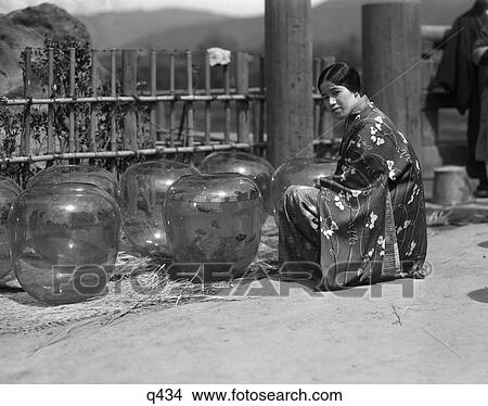 1930 1930S Unsimiling Japanese Woman In Kimono Kneeling By Group Large Gold Fish Bowls Street Goldfish Market In Kobe Rrr Retro View Large Photo Image Picture - 1930 1930S Unsimiling Japanese Woman In Kimono Kneeling By Group Large Gold Fish Bowls Street Goldfish Market In Kobe Rrr Retro. Fotosearch