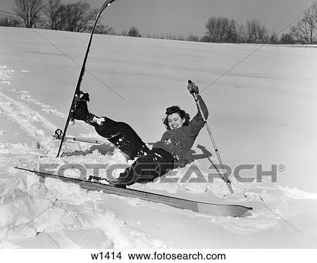 1930 1930S Woman Falling In Snow On Skis Laughing View Large Photo Image Picture - 1930 1930S Woman Falling In Snow On Skis Laughing . Fotosearch