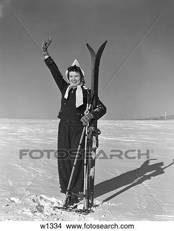 1930 1930S Woman Holding Skis In Snow Waving View Large Photo Image Picture - 1930 1930S Woman Holding Skis In Snow Waving . Fotosearch