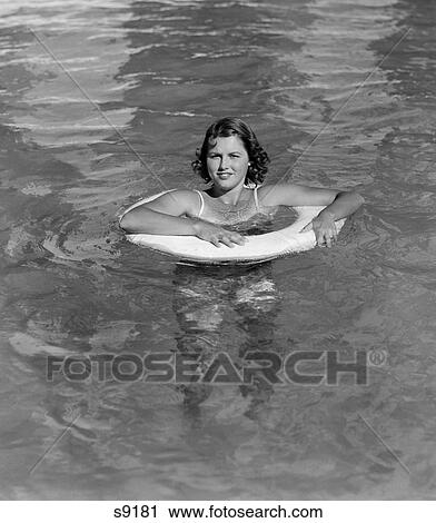 1930 1930S Woman In Pool In Innertube View Large Photo Image Stock Image - 1930 1930S Woman In Pool In Innertube . Fotosearch