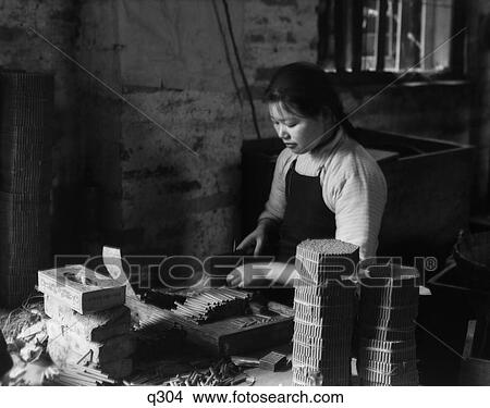1930S 1930 Chinese Girl Cutting Paper Tubes Firecracker Factory Work Hong Kong China Firecrackers Gunpowder View Large Photo Image Picture - 1930S 1930 Chinese Girl Cutting Paper Tubes Firecracker Factory Work Hong Kong China Firecrackers Gunpowder. Fotosearch