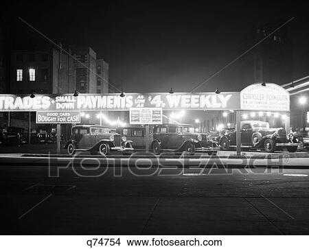 1930S 1930 New And Used Car Lot Night New York City Greenwich Village Auto Automotive Automobile Sales Sixth Avenue And Waverly View Large Photo Image Picture - 1930S 1930 New And Used Car Lot Night New York City Greenwich Village Auto Automotive Automobile Sales Sixth Avenue And Waverly. Fotosearch