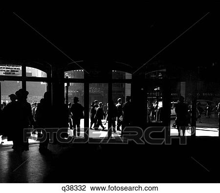 1930S 1930 Silhouetted Pedestrians & Traffic Outside The Doors Of Grand Central Station Manhattan New York Retro View Large Photo Image Stock Image - 1930S 1930 Silhouetted Pedestrians & Traffic Outside The Doors Of Grand Central Station Manhattan New York Retro. Fotosearch