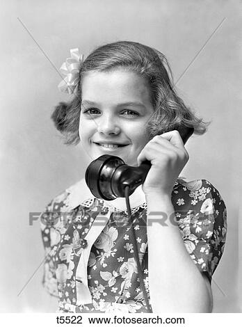 1930S 1940S 1940 Smiling Little Girl In A Print Dress Talking On ...