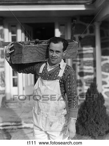 1930S 1940S Carpenter On Construction Site Carrying Tool Box On Shoulder Wearing Overalls Smiling View Large Photo Image Stock Image - 1930S 1940S Carpenter On Construction Site Carrying Tool Box On Shoulder Wearing Overalls Smiling . Fotosearch