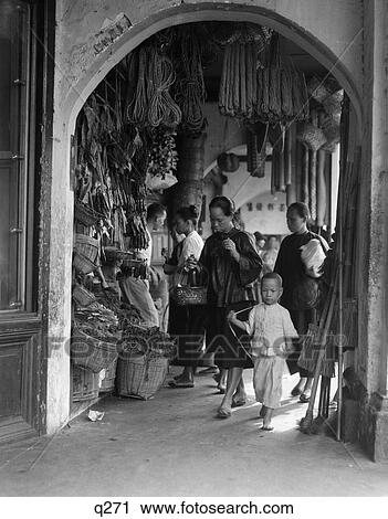 1930S 1940S Covered Sidewalk Market Street Scene In Singapore Shop Shopping Local Little Asian Boy With Mother In Market View Large Photo Image Stock Image - 1930S 1940S Covered Sidewalk Market Street Scene In Singapore Shop Shopping Local Little Asian Boy With Mother In Market. Fotosearch