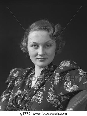1930S 1940S Middle Aged Woman Portrait Looking At Camera Floral Print Dress View Large Photo Image Stock Photography - 1930S 1940S Middle Aged Woman Portrait Looking At Camera Floral Print Dress . Fotosearch