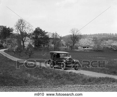 1930S 1940S Packard On Dirt Road With Woman Standing Outside Passenger Side View Large Photo Image Stock Image - 1930S 1940S Packard On Dirt Road With Woman Standing Outside Passenger Side . Fotosearch