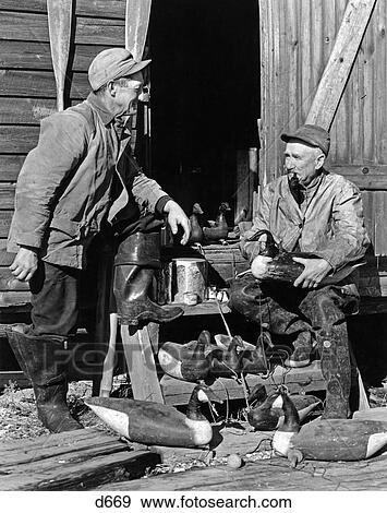1930S 1940S Two Senior Men Sitting Wooden Steps Wearing Hunting Clothes Holding Duck Decoys View Large Photo Image Stock Photo - 1930S 1940S Two Senior Men Sitting Wooden Steps Wearing Hunting Clothes Holding Duck Decoys . Fotosearch