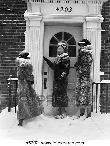 1930S 3 Women Fur Coats Ring Door Bell Front Door Brick Building Snow Wear Hats Gloves Boots Fashion Visit Cold View Large Photo Image Stock Image - 1930S 3 Women Fur Coats Ring Door Bell Front Door Brick Building Snow Wear Hats Gloves Boots Fashion Visit Cold . Fotosearch