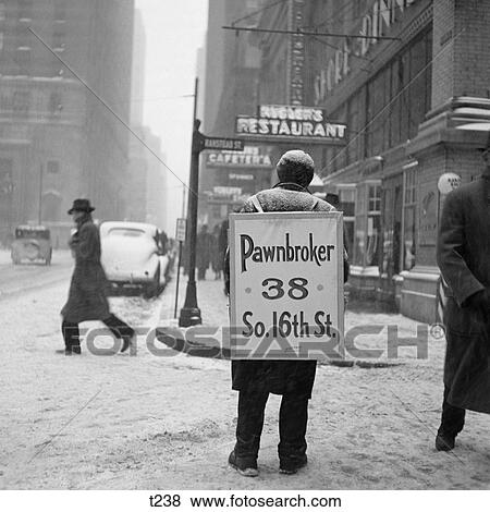 1930S-40S Winter Street Scene Of Man Wearing Pawnbroker Sandwich Board View Large Photo Image Stock Photo - 1930S-40S Winter Street Scene Of Man Wearing Pawnbroker Sandwich Board . Fotosearch