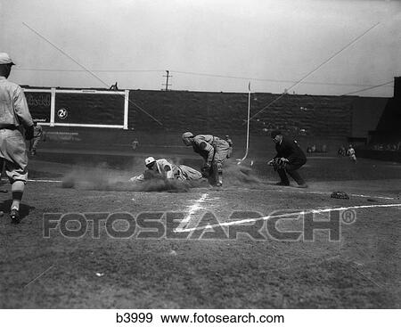 Stock Photo - 1930S Baseball Player Sliding Into Home Base Catcher Umpire . Fotosearch
