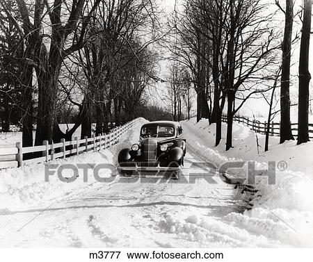 1930S Car Driving Down Snowy Country Road View Large Photo Image Stock Photo - 1930S Car Driving Down Snowy Country Road . Fotosearch
