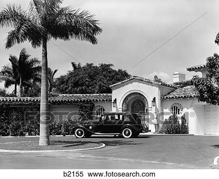 1930S Car In Circular Driveway Of Tropical Stucco Spanish Style Home In Sunset Islands Miami Beach Fl View Large Photo Image Stock Photography - 1930S Car In Circular Driveway Of Tropical Stucco Spanish Style Home In Sunset Islands Miami Beach Fl . Fotosearch